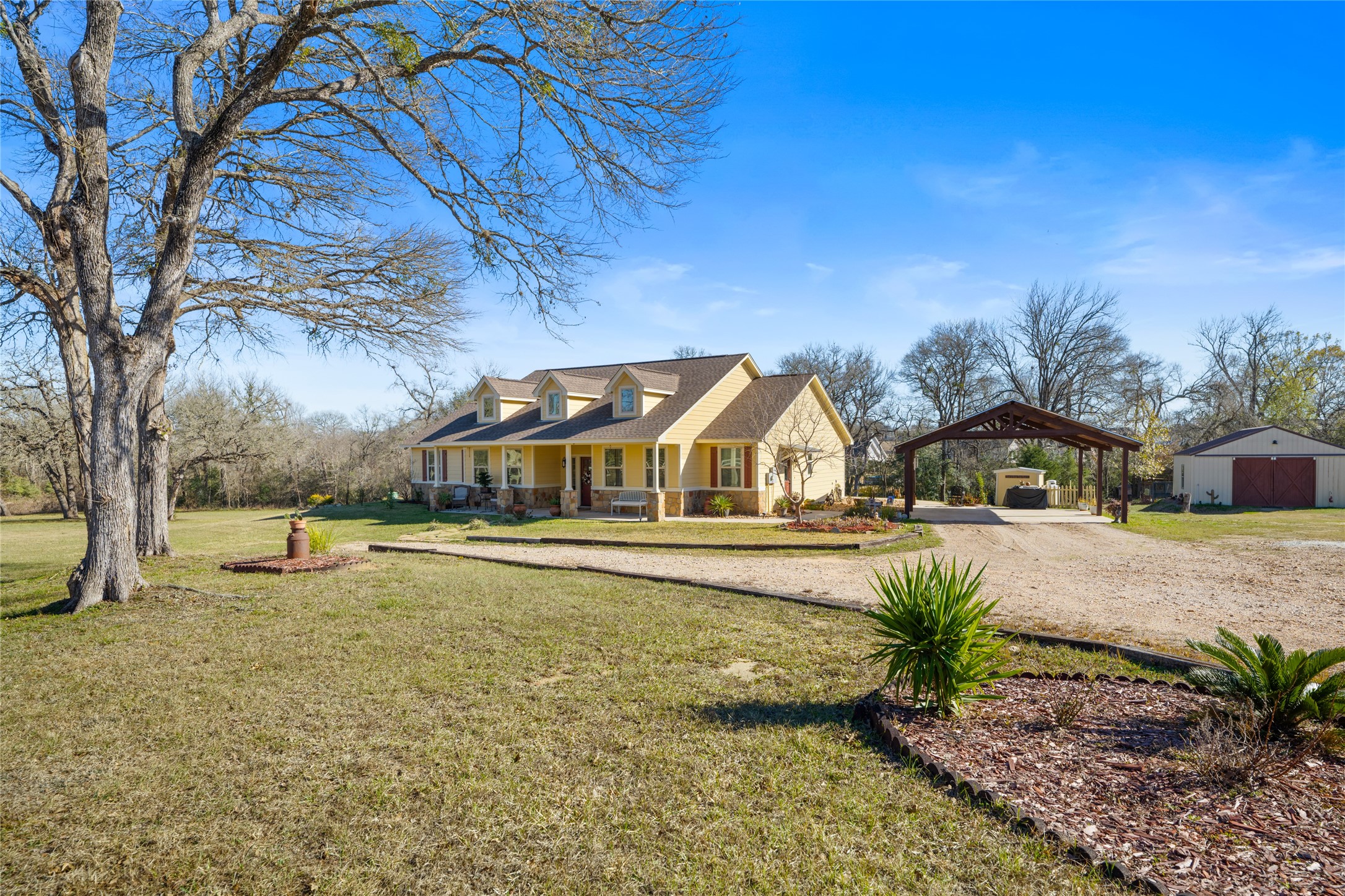 9467 Loop Road Bellville, TX 77418 - Photo 5 of 26 a front view of a house with a yard