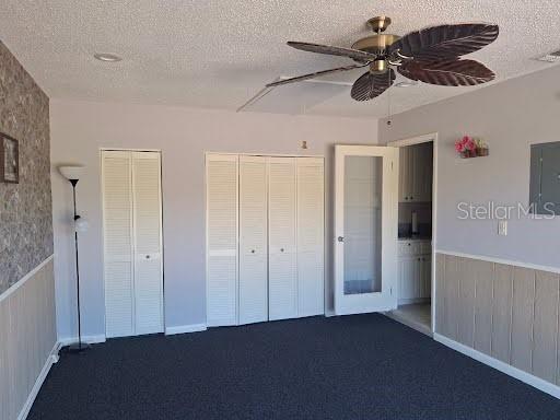 4932 Ilener Street New Port Richey, FL 34652 - Photo 16 of 38 a view of a livingroom and a chandelier fan
