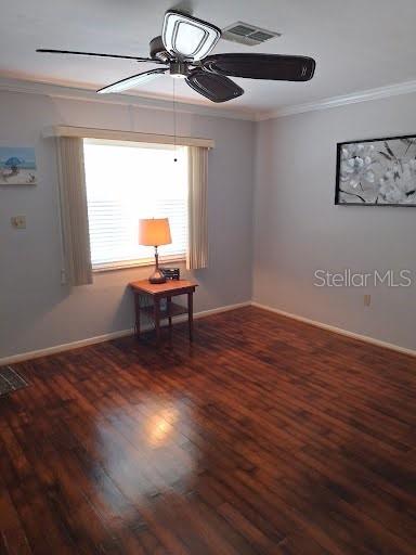 4932 Ilener Street New Port Richey, FL 34652 - Photo 4 of 38 a workspace with wooden floor and a window