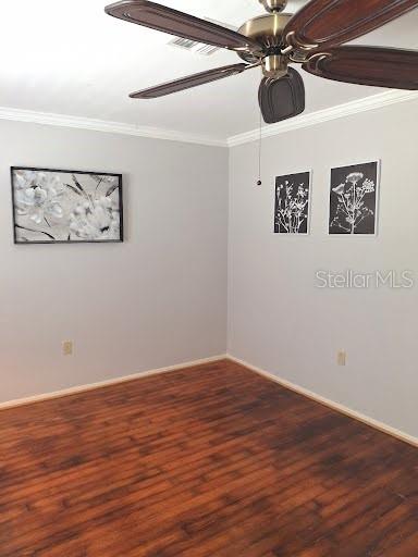 4932 Ilener Street New Port Richey, FL 34652 - Photo 5 of 38 a view of a room with wooden floor