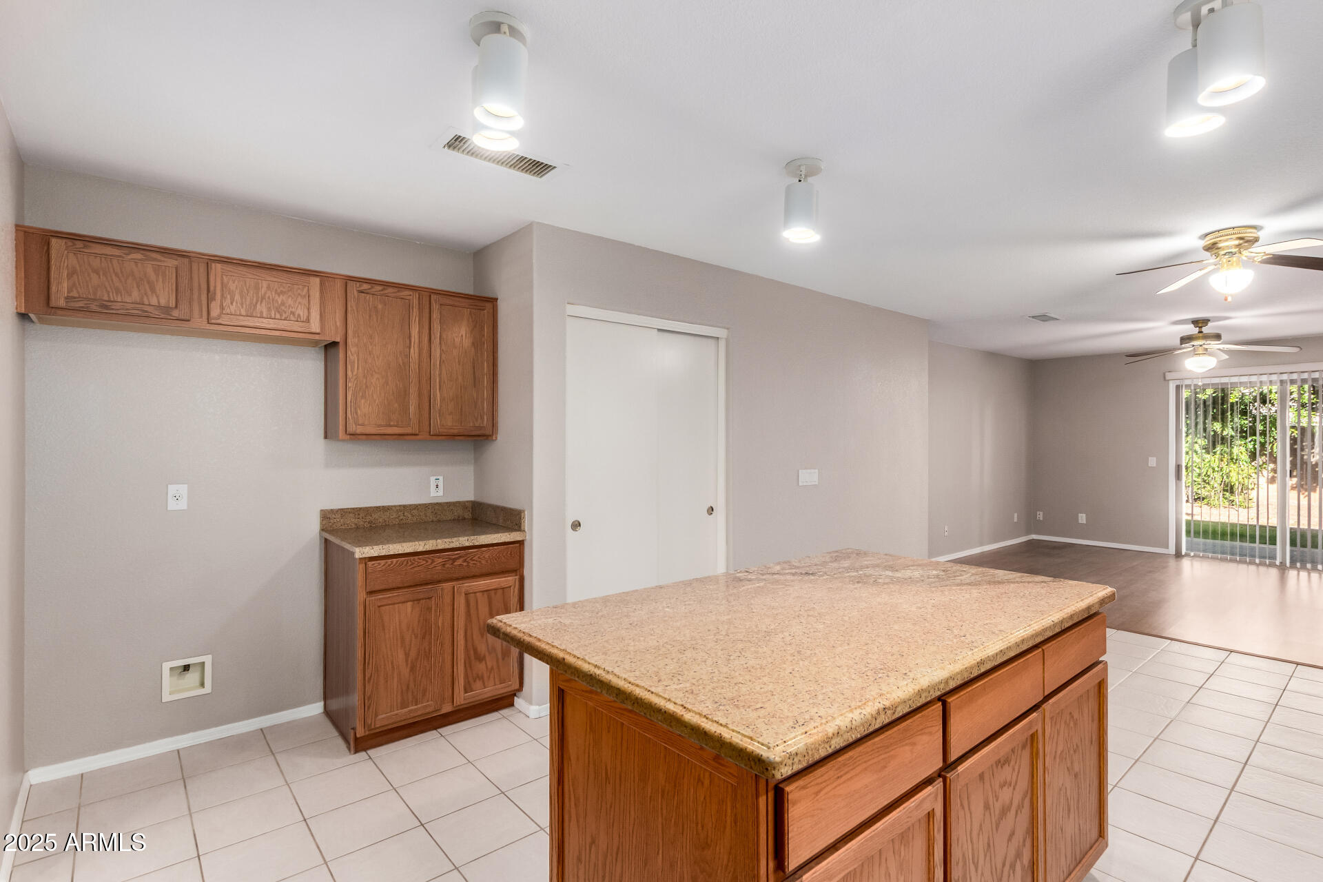 3822 West Fallen Leaf Lane Glendale, AZ 85310 - Photo 13 of 35 a kitchen with kitchen island cabinets and wooden floor