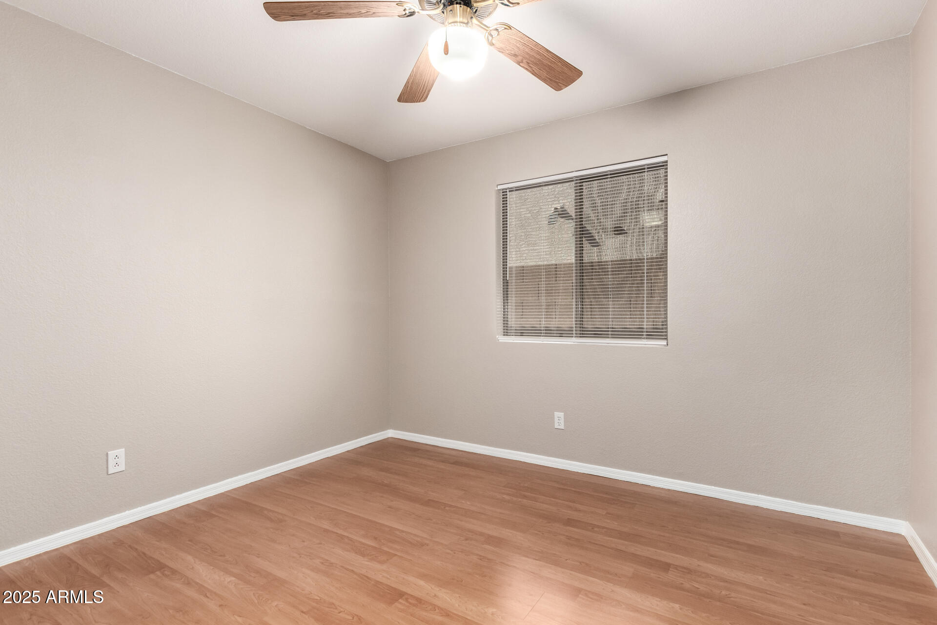 3822 West Fallen Leaf Lane Glendale, AZ 85310 - Photo 20 of 35 wooden floor in an empty room with a window