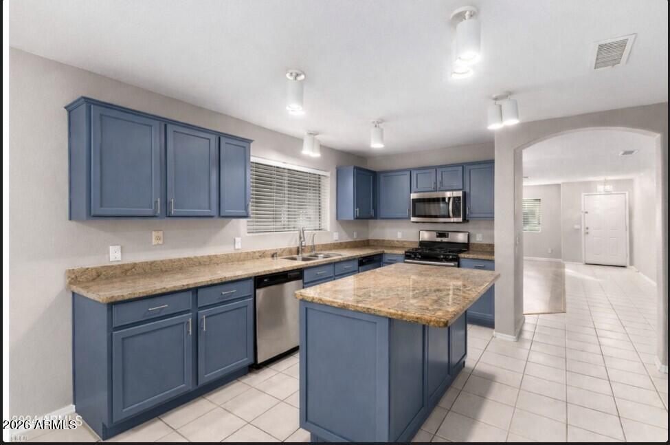 3822 West Fallen Leaf Lane Glendale, AZ 85310 - Photo 32 of 35 a kitchen with a sink a counter top space and appliances