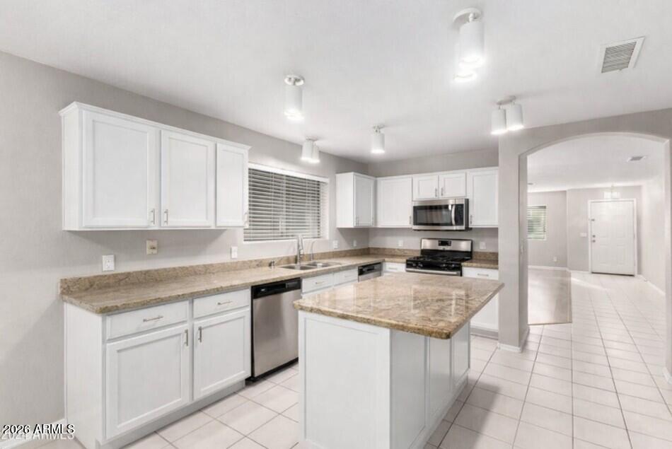 3822 West Fallen Leaf Lane Glendale, AZ 85310 - Photo 35 of 35 a kitchen with a sink a counter top space cabinets and stainless steel appliances