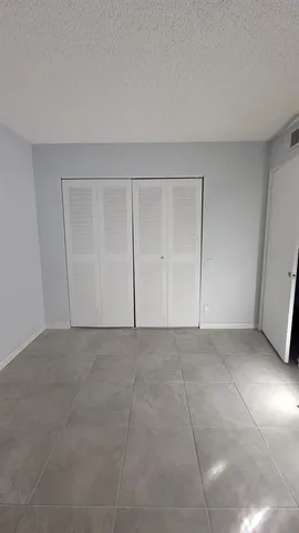 a view of an empty room and entryway