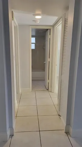 a view of hallway with shower