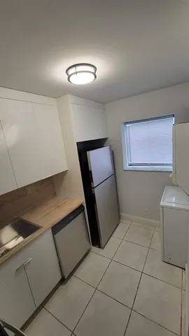 a view of room with window and hardwood floor