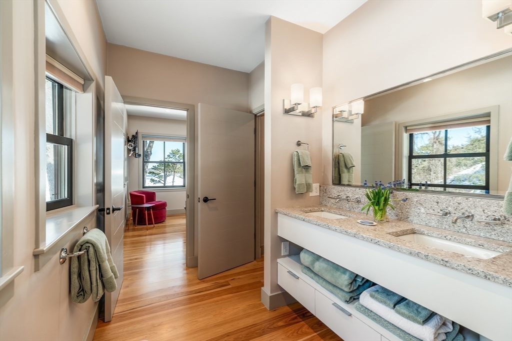 15 Lufkin Point Road Essex, MA 01929 - Photo 12 of 41 a spacious bathroom with a granite countertop sink a mirror and shower