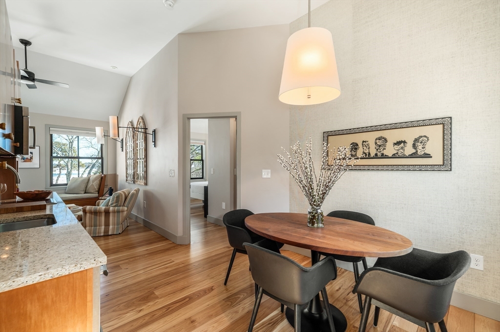 15 Lufkin Point Road Essex, MA 01929 - Photo 14 of 41 a view of a dining room with furniture and wooden floor