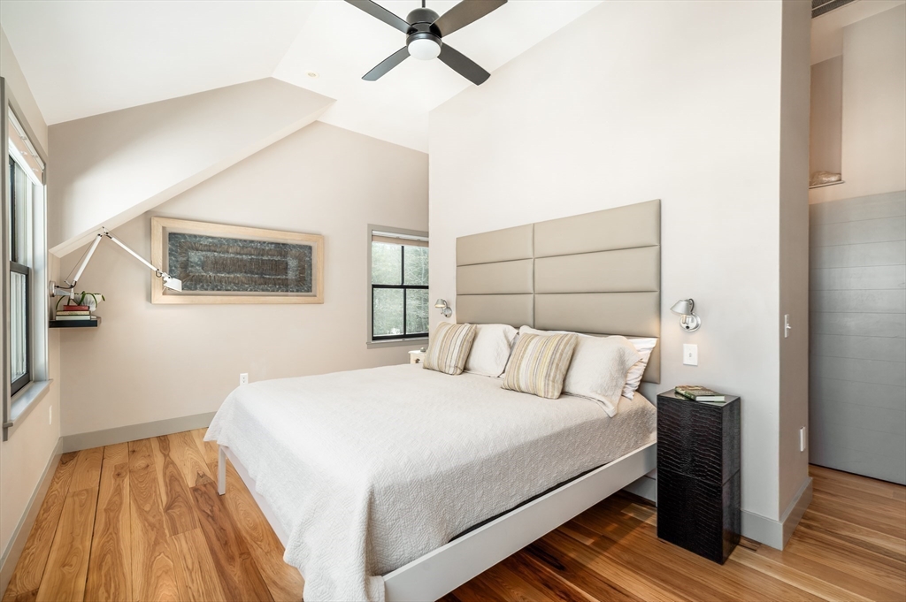 15 Lufkin Point Road Essex, MA 01929 - Photo 19 of 41 a bedroom with a bed and wooden floor