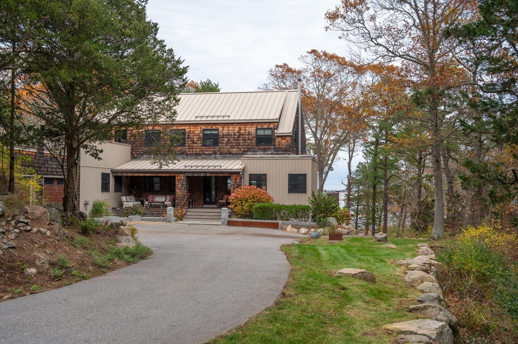 15 Lufkin Point Road Essex, MA 01929 - Photo 2 of 41 a front view of a house with garden and trees