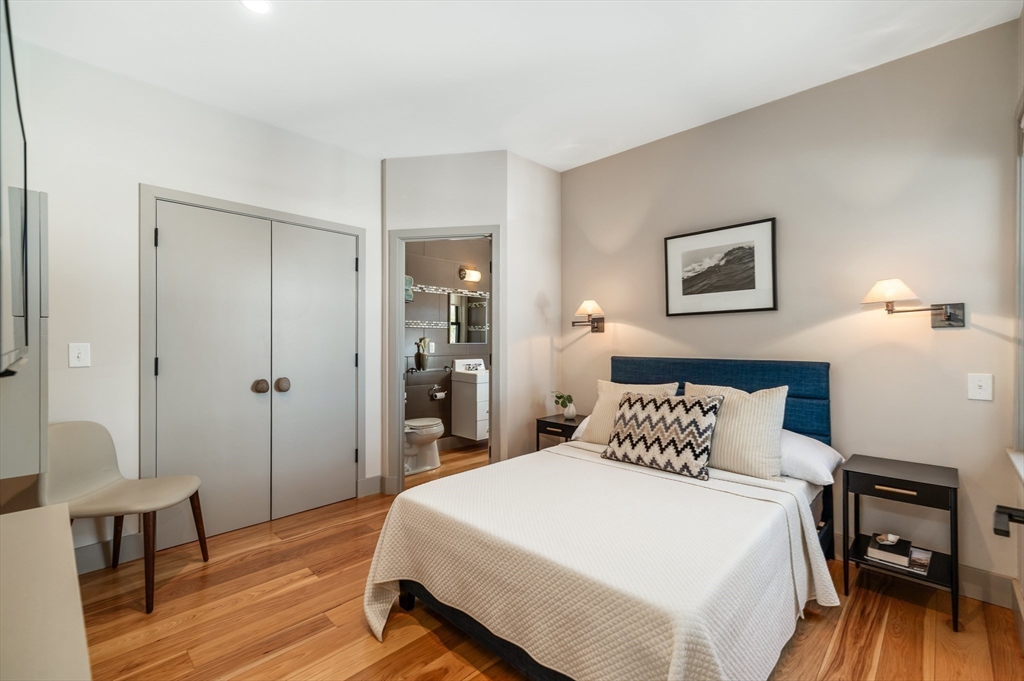 15 Lufkin Point Road Essex, MA 01929 - Photo 26 of 41 a bedroom with a bed and wooden floor