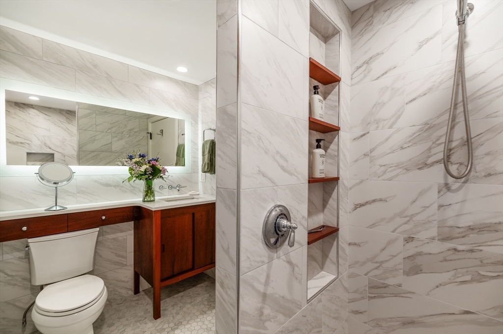 15 Lufkin Point Road Essex, MA 01929 - Photo 31 of 41 a bathroom with a toilet sink and mirror