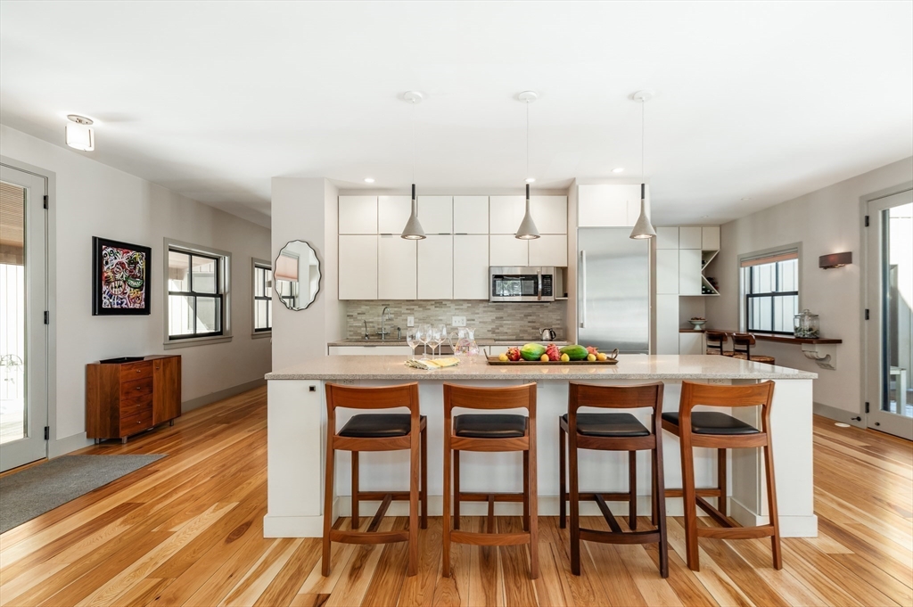 15 Lufkin Point Road Essex, MA 01929 - Photo 6 of 41 a view of a dining room with furniture and wooden floor