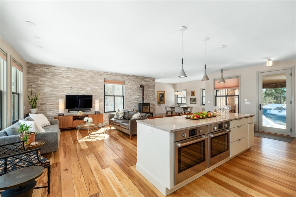 15 Lufkin Point Road Essex, MA 01929 - Photo 7 of 41 a open kitchen with stainless steel appliances stove top oven and cabinets