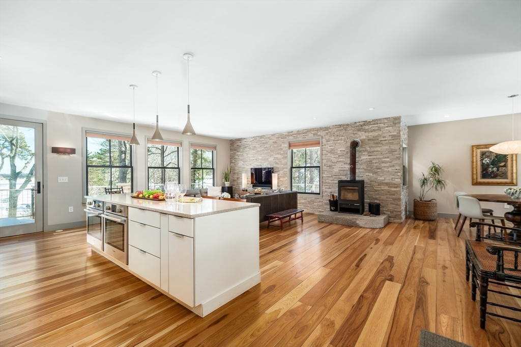 15 Lufkin Point Road Essex, MA 01929 - Photo 8 of 41 a large white kitchen with sink stove and refrigerator