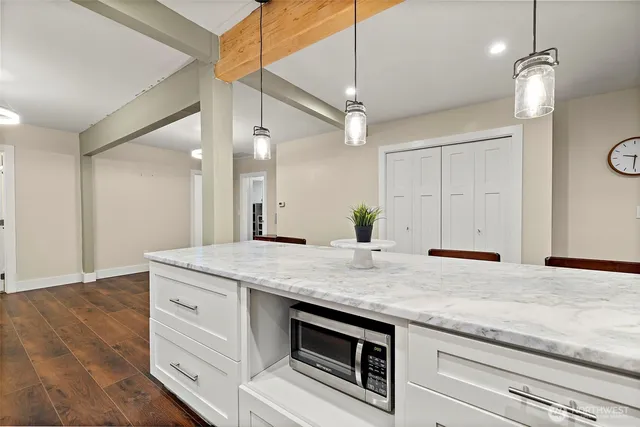 a kitchen with a sink and a refrigerator