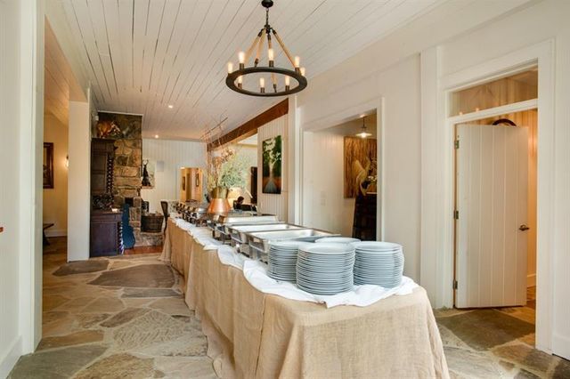 a kitchen with stainless steel appliances granite countertop a stove and a sink