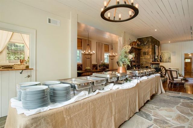 a kitchen with stainless steel appliances granite countertop a stove and cabinets