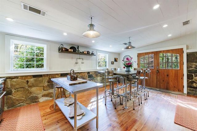 a view of a dining room with furniture window and outside view