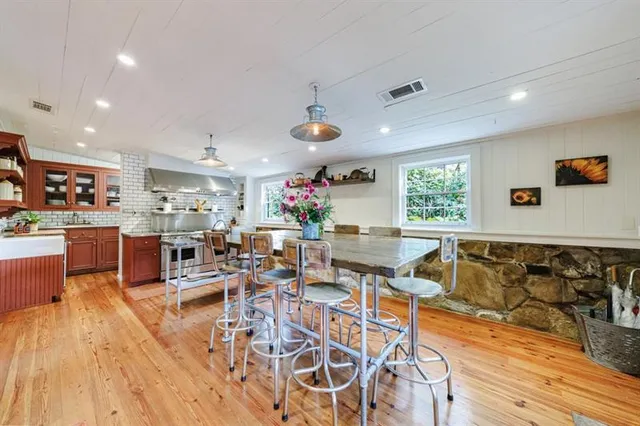 a view of a dining room with furniture and window