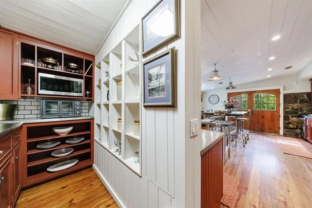 a living room with furniture a dining table and chairs with outer view