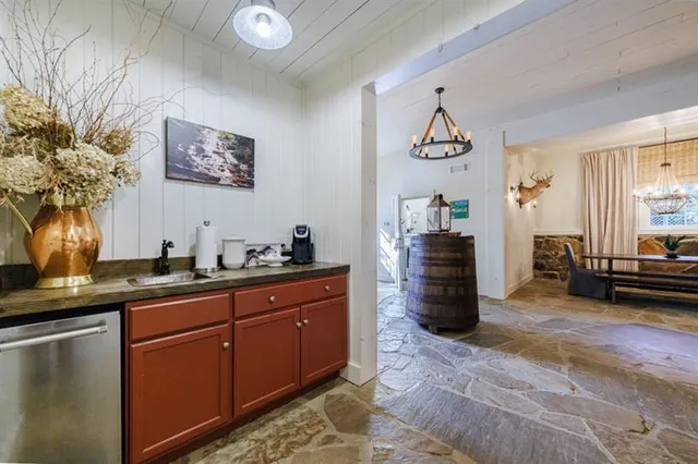 a bathroom with a granite countertop sink toilet and a mirror