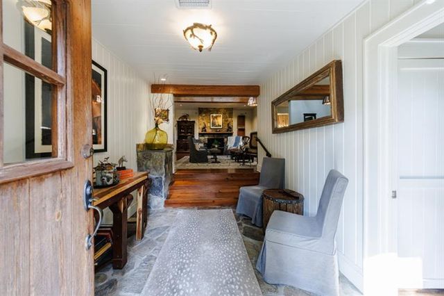 a bedroom with a bed and a night stand