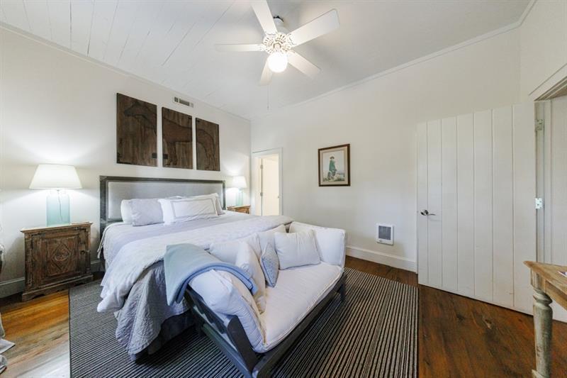 31 Barn Inn Road Lakemont, GA 30552 - Photo 35 of 86 a bedroom with a large bed chandelier and a window