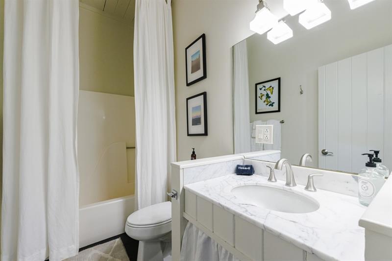 31 Barn Inn Road Lakemont, GA 30552 - Photo 36 of 86 a bathroom with a granite countertop sink toilet and a mirror