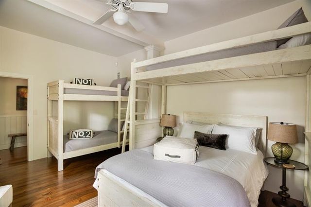 a bedroom with a bed and furniture