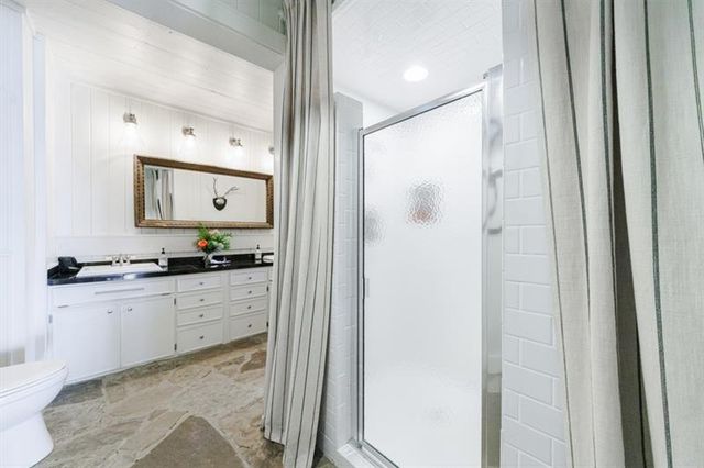 a bathroom with a sink and mirror