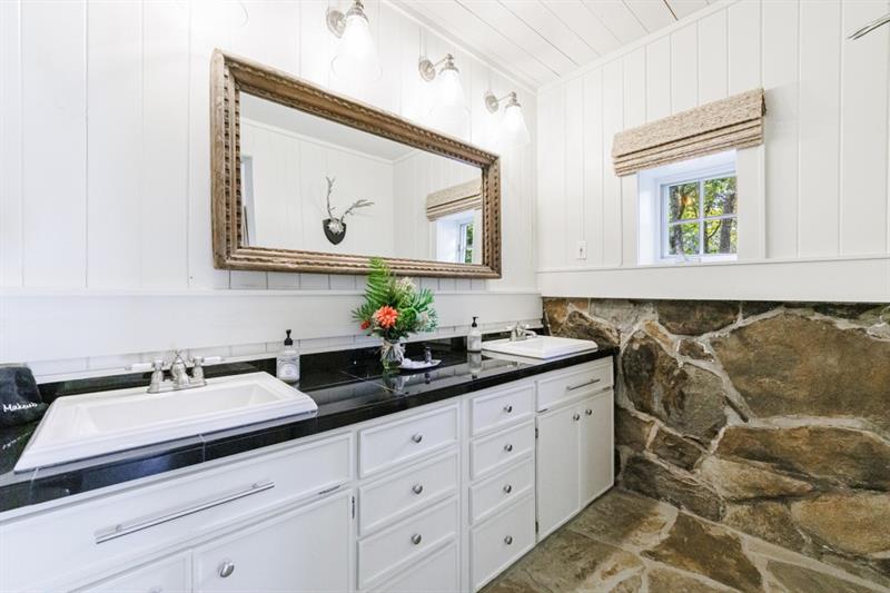 31 Barn Inn Road Lakemont, GA 30552 - Photo 41 of 86 a bathroom with a double vanity sink and a mirror