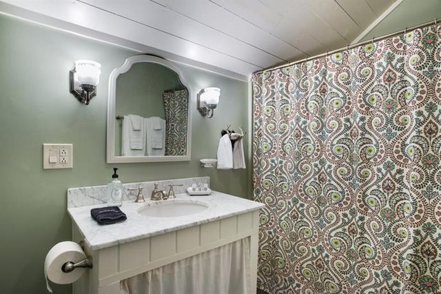 a backyard of a house with table and chairs