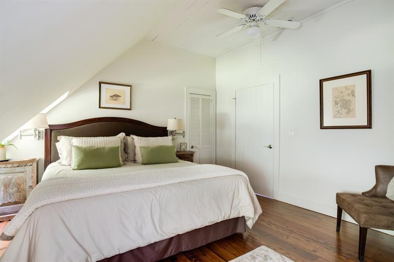 31 Barn Inn Road Lakemont, GA 30552 - Photo 47 of 86 a bedroom with a large bed and a chandelier