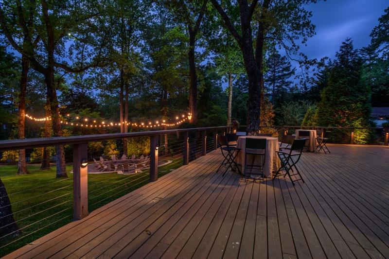 31 Barn Inn Road Lakemont, GA 30552 - Photo 64 of 86 a view of a roof deck with table and chairs a barbeque with wooden floor and fence
