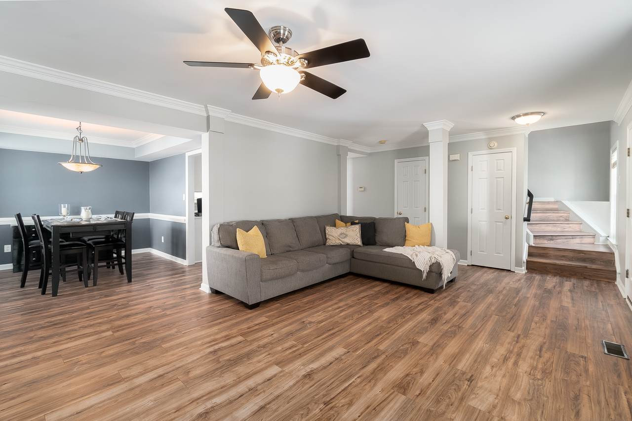 8727 Harps Mill Road Raleigh, NC 27615 - Photo 25 of 25 Beautiful on trend paint colors accent the flooring and OPEN CONCEPT floor plan of this home. Den/Family/Great Room