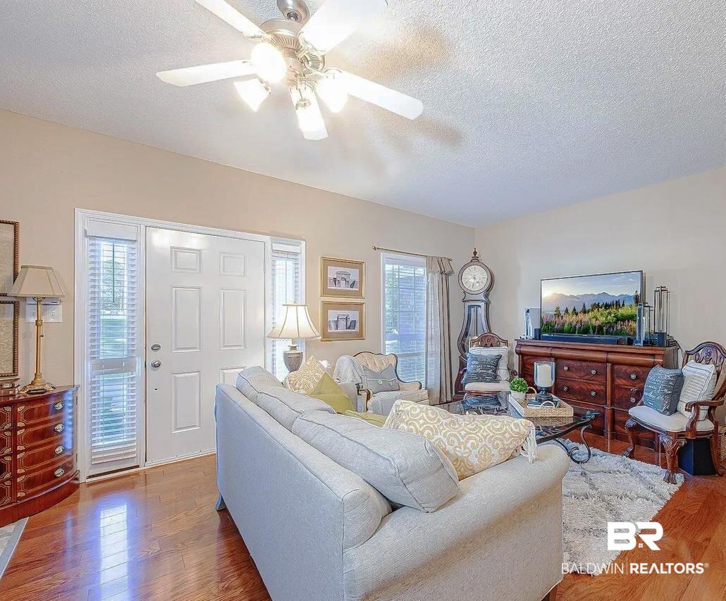 12230 Bromley Road Stapleton, AL 36578 - Photo 5 of 34 Living room with wood finished floors, a textured ceiling, and a ceiling fan