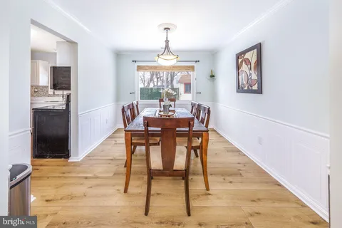 a living room with furniture a rug and a table