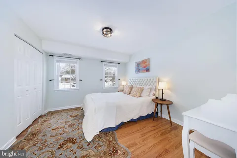 a bedroom with a bed and a desk