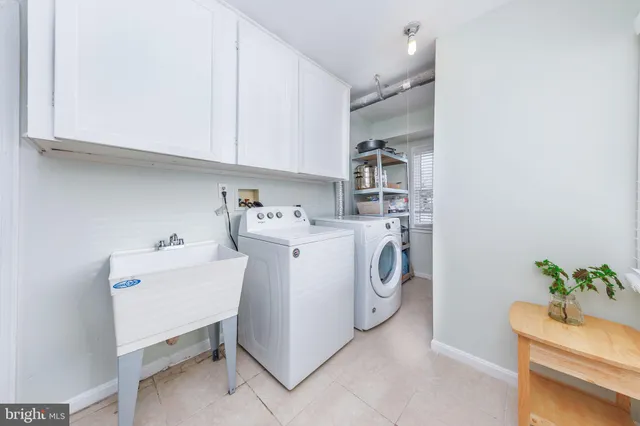 a view of a hallway with wooden floor and stairs
