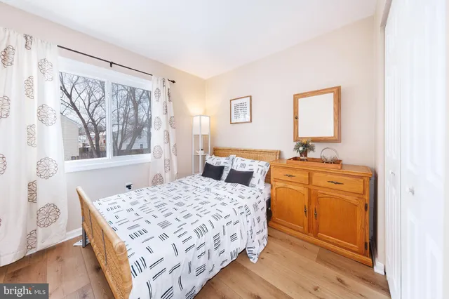 a bathroom with a sink toilet mirror vanity and shower