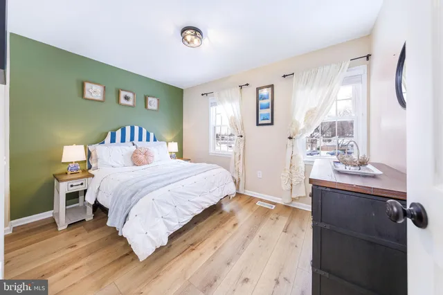 a bedroom with a bed and cabinets