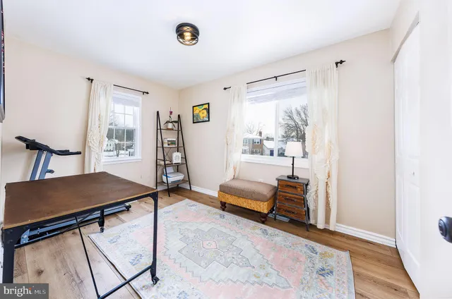 a view of a livingroom with furniture and a window