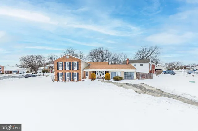 a view of a swimming pool and lounge chairs
