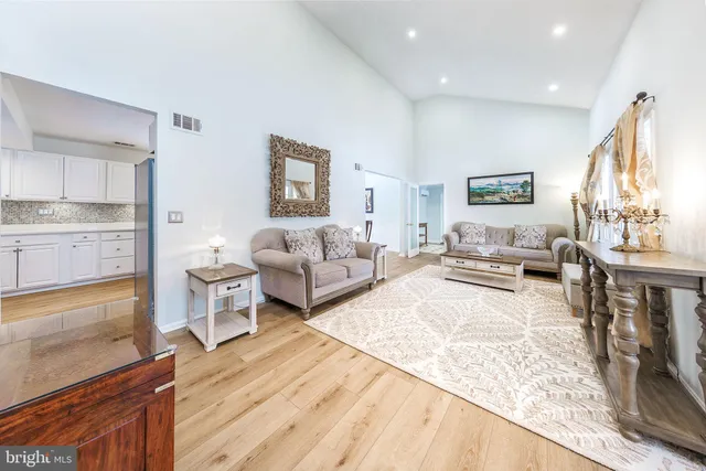 a kitchen with granite countertop a stove top oven sink and cabinets