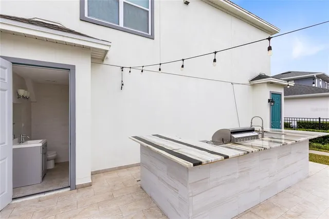 a view of a kitchen counter space and a sink