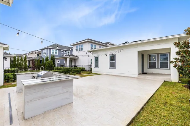 a view of house with yard outdoor seating and entertaining space