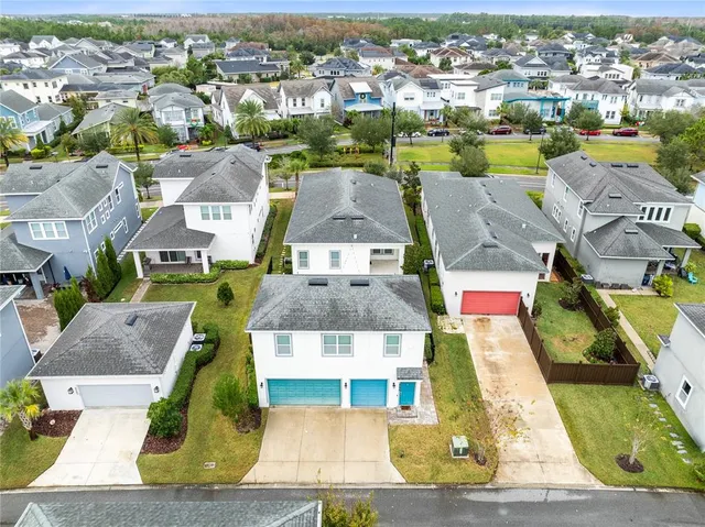 an aerial view of residential houses with outdoor space