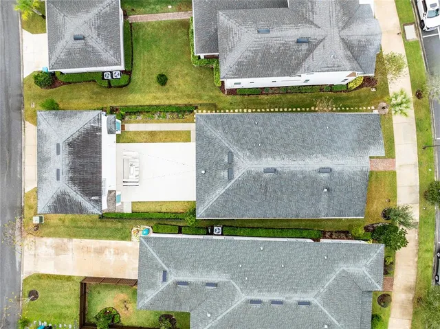 an aerial view of a house with a swimming pool